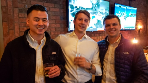 Capstone team members socializing at an event